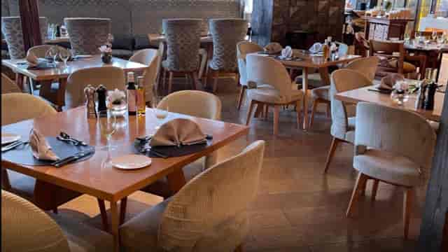 La Brasserie restaurant dining room with plush seating for corporate events and business lunches.