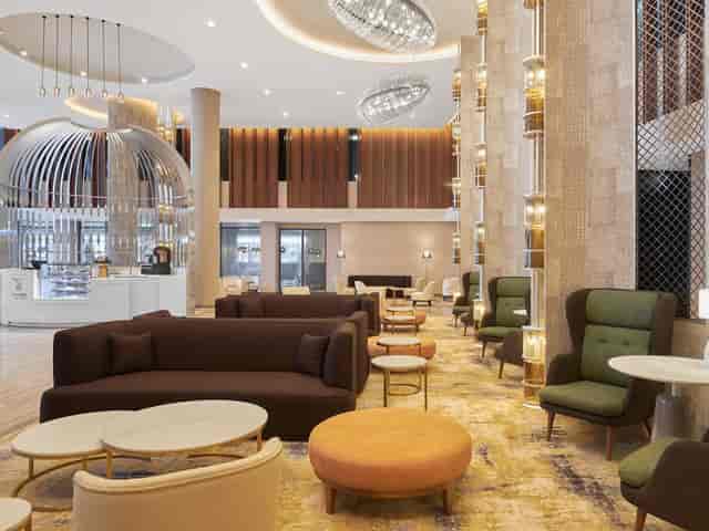 Modern meeting rooms at Radisson Blu Riyadh featuring tiered seating for corporate events.