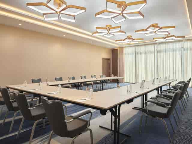 U-shaped conference room in Riyadh convention center for professional corporate meetings.