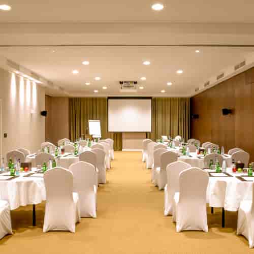 Cabaret-style meeting room at AlUla Shaza Riyadh for interactive workshops and corporate events.
