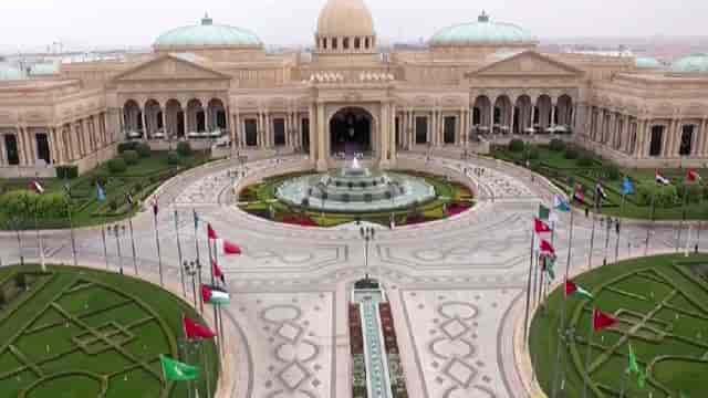 King Abdulaziz International Conference Center hall with flags for diplomatic summits and events.