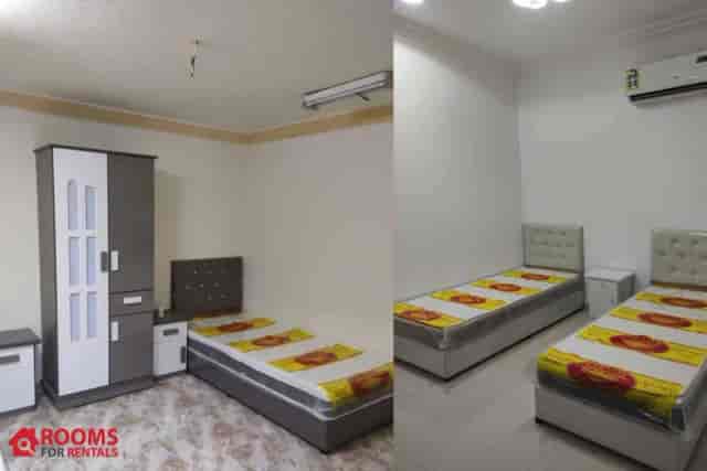Private room in QEUZ: compact lodging with functional design for budget travel and event housing.