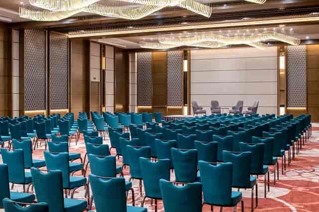 Pillar-less Hilton Garden Inn Riyadh ballroom, theater seating for corporate events and conferences.
