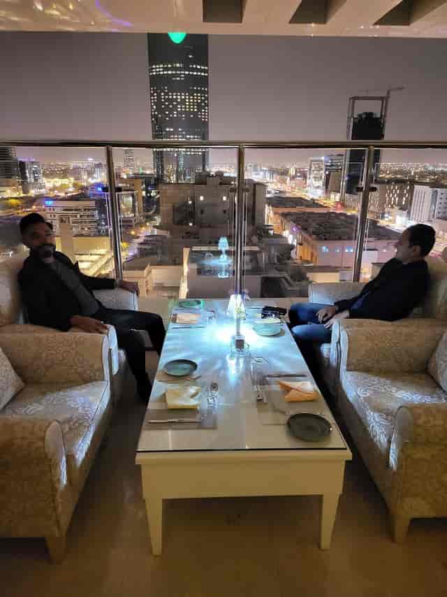 Al Maha Café, Riyadh: VIP private dinner setup with dramatic skyline views for exclusive networking.