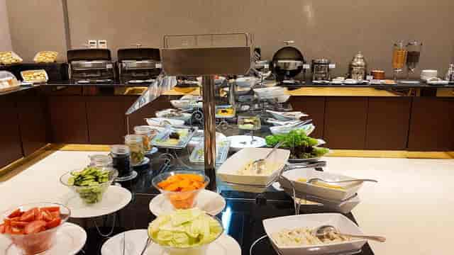 Breakfast buffet setup at Al Hamra Palace Riyadh with fresh salads and hot dishes for events.