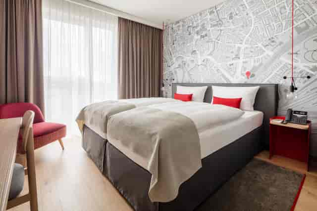 IntercityHotel Riyadh Malaz twin suite with workspace for corporate travel and events.