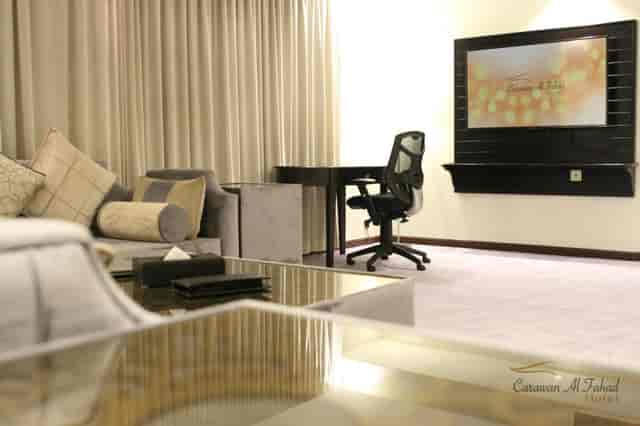 Executive suite with ergonomic workspace at Carawan AlFahad Hotel for VIP business travel.