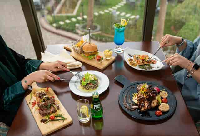 Al Hamra VIP lunch in Crowne Plaza Riyadh Al Waha with garden views for upscale B2B meetings.