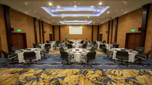Seven Gardens banquet hall with round tables for social events and corporate meetings.
