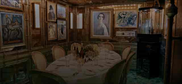 Elegant private dining room with wood paneling for VIP dinners and corporate board meetings.