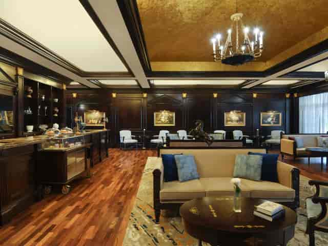 Elite lounge at Al Aziziyah Boutique Hotel: wood-paneled VIP hospitality and conference space.