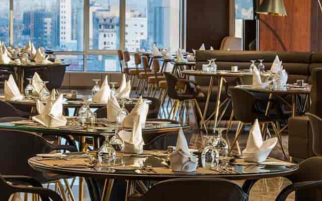 Upscale Braira Al Wizarat dining hall with modern table settings for corporate banquet events.