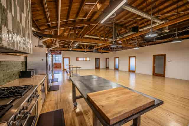 HHS East industrial event space with professional kitchen for culinary workshops and team building.