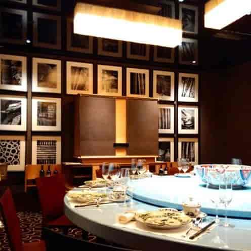 Garden Suite for VIP dinner and executive board meeting with elegant gallery wall and table.