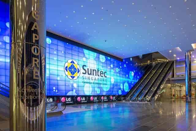Large LED video wall in Suntec City exhibition hall for event branding and convention signage.