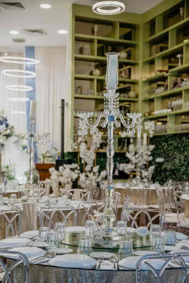 Elegant Tiara Waterfront ballroom table setting with crystal candelabras for formal events.