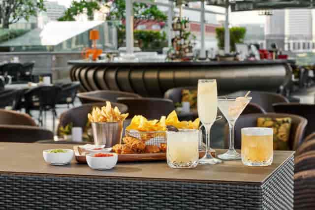 Luxe rooftop bar for networking reception and corporate event with premium drink service.