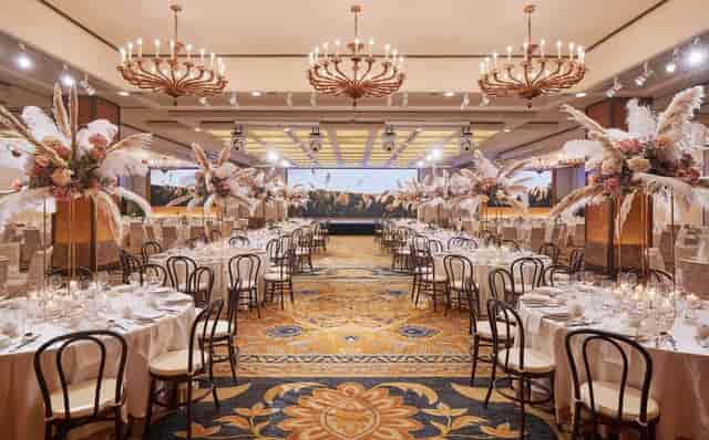 Luxury ballroom with pampas grass centerpieces for weddings and gala events in Singapore.