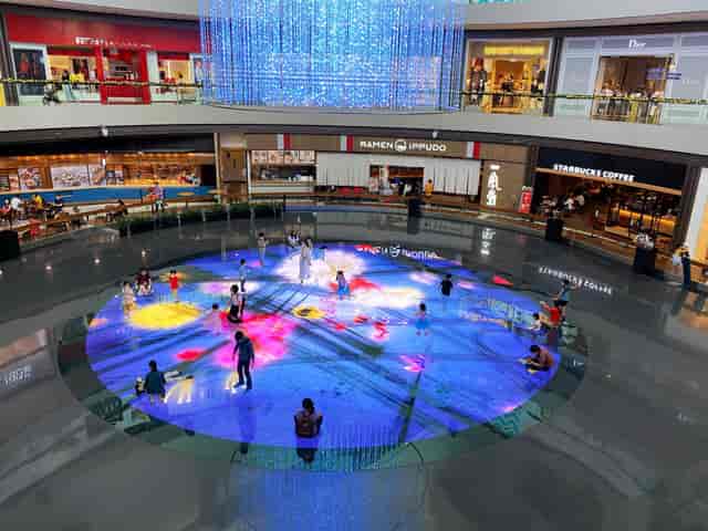 Interactive floor projection at teamLab Digital Light Canvas for experiential event activation.