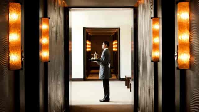 Luxurious meeting room corridor at Mandarin Oriental Al Faisaliah, Riyadh, featuring elegant service.