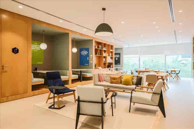 Coworking breakout space with private booths for office meetings and professional networking.