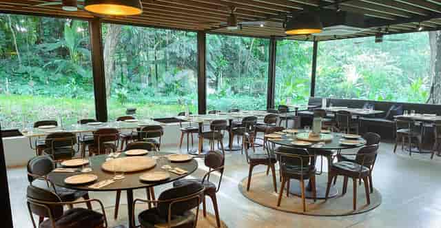 Atout Restaurant: Light-filled venue for corporate luncheons and upscale events with large windows.