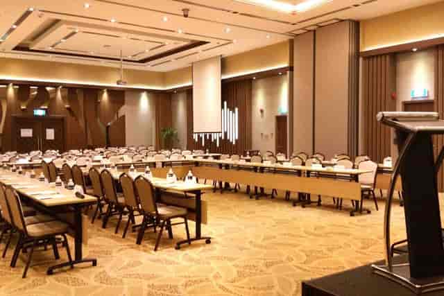 U-shaped conference setup in The Events Centre ballroom for a professional plenary session.