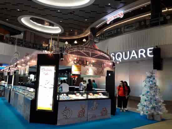 Branded Christmas kiosks at Village Square, retail activation and seasonal event space.