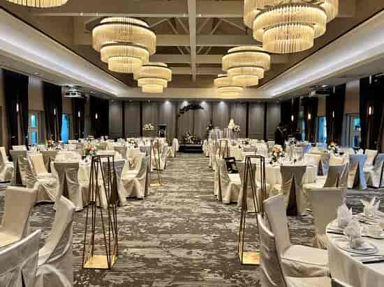 Revelry Hall ballroom with tiered chandeliers for formal social galas and corporate receptions.