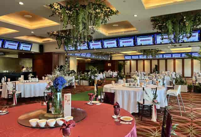 Singapore Turf Club banquet room with floral decor for hybrid corporate events and conferences.