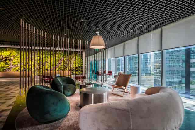 Private office at The Work Project CapitaSky: upscale corporate meeting space with biophilic design.
