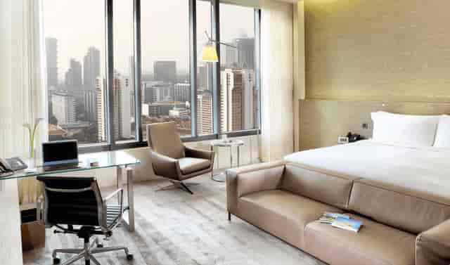 One Farrer Hotel executive meeting room with city skyline view for corporate business events.