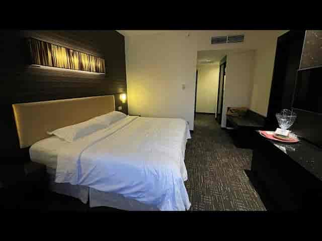 Modern Hotel Royal suite with workspace, ideal for business travel and corporate lodging.