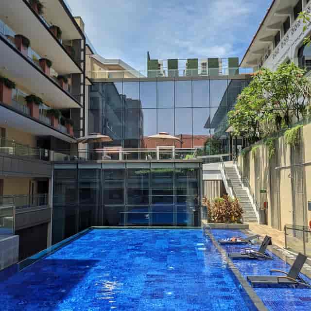 Modern poolside courtyard at Oasia Resort Sentosa for outdoor receptions and corporate events.