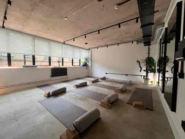 Industrial-chic Bulba Studio space for corporate wellness and team-building workshops.