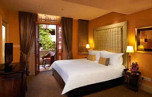 Luxury hotel suite with private balcony at The Scarlet Singapore for VIP conference delegates.