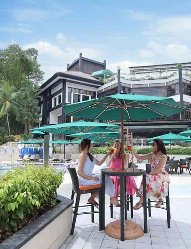 Poolside networking at The British Club: upscale bistro seating for corporate incentive events.