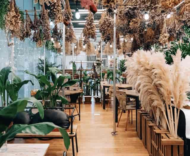 Botanical garden restaurant with suspended florals for intimate events and brand activations.