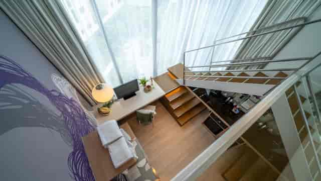 Executive meeting room at Studio M Hotel with natural light for VIP corporate events.