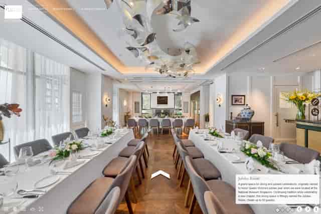Sophisticated Flutes Restaurant terrace with symmetrical banquet tables for corporate dining.