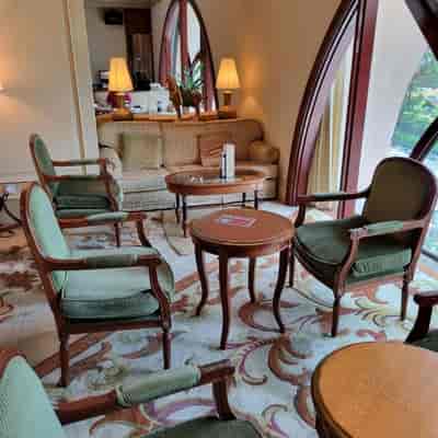 Mahogany Room at Raffles Town Club, a classic hotel lobby nook for small-group breakout meetings.