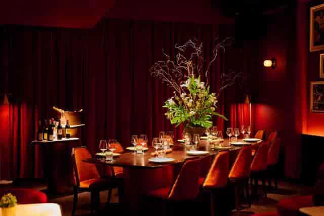 Luxurious private dining room with velvet decor, ideal for exclusive board dinners and VIP events.