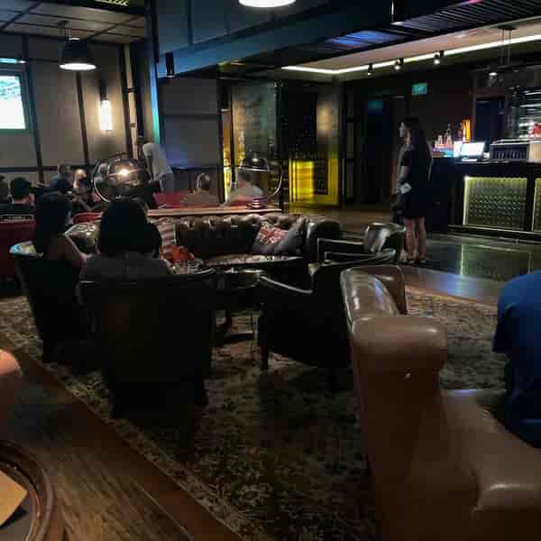 Plush leather lounge at Cook & Brew gastropub, ideal for corporate networking and private events.