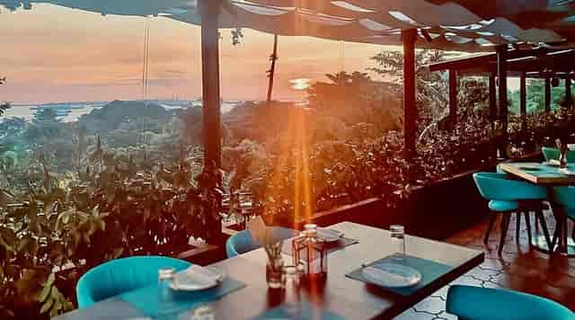 Open-air restaurant at The Cliff with sunset backdrop for upscale incentive dinner and VIP events.