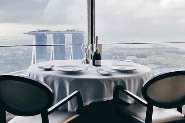 VIP private dining room at JAAN by Kirk Westaway with iconic city skyline views for luxury events.