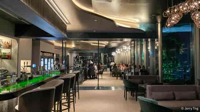 Contemporary rooftop bar in Kaarla with lounge seating for upscale corporate networking events.