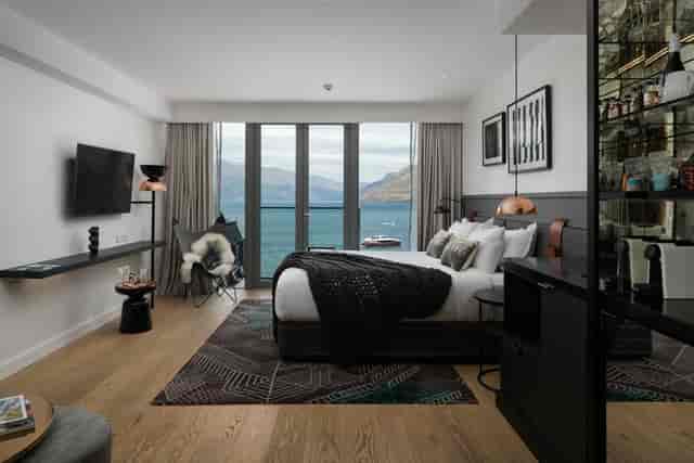 Modern VIP guest room at Rees QT Queenstown with waterfront view for corporate incentive travel.