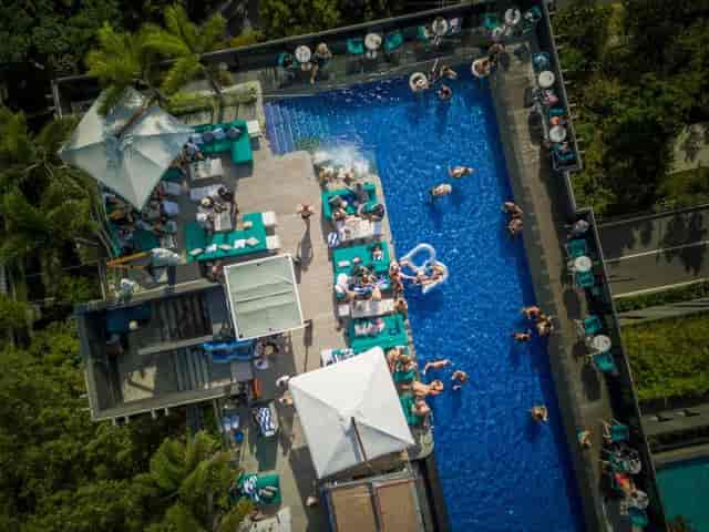 Rooftop bar with pool at 1-Altitude Coast, ideal for luxury networking and corporate events.