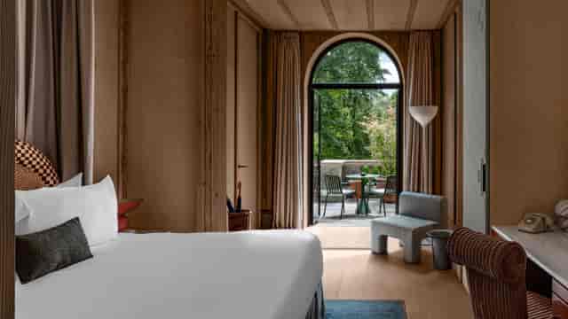 Luxury executive suite with private balcony for VIP corporate meetings and breakout sessions.