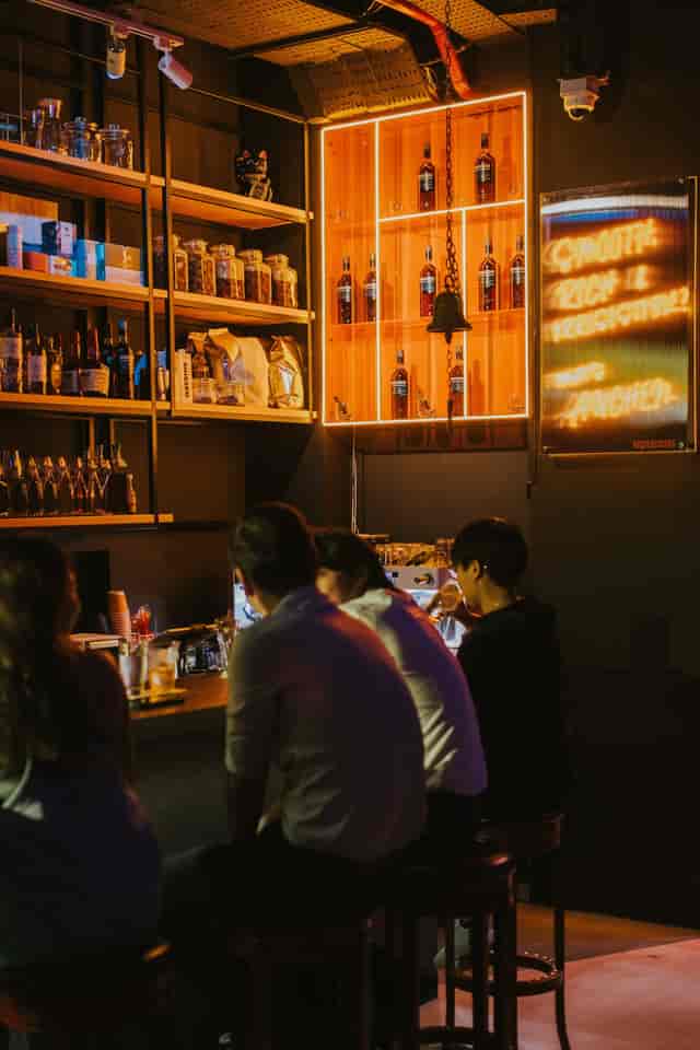 Highball bar with industrial decor for professional networking event and corporate mixer.